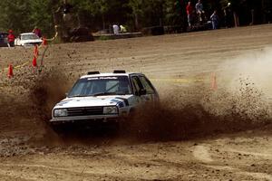 Eric Burmeister / Mark Buskirk VW GTI hits a large puddle on SS8, Speedway Shennanigans.