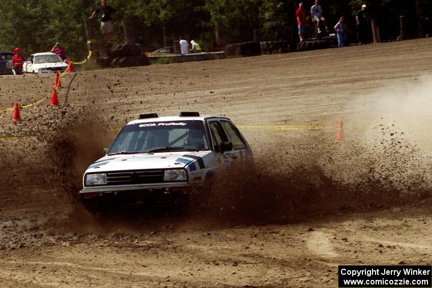 Eric Burmeister / Mark Buskirk VW GTI hits a large puddle on SS8, Speedway Shennanigans.