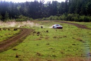 Garen Shrader / Michael Fennell Mitsubishi Lancer Evo IV goes wide at a corner on SS11, Ranch Super Special I.