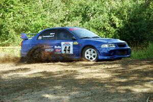 Peter Cunningham / Jim Gill Mitsubishi Lancer Evo VI at the spectator corner on SS10, Kabekona.