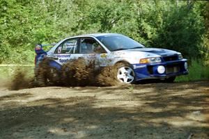 Karl Scheible / Russ Hughes Mitsubishi Lancer Evo V at the spectator corner on SS10, Kabekona.