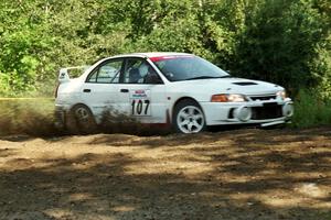 Tim Paterson / Scott Ferguson Mitsubishi Lancer Evo IV at the spectator corner on SS10, Kabekona.