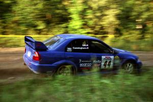 Peter Cunningham / Jim Gill Mitsubishi Lancer Evo VI at speed on SS14, East Steamboat.