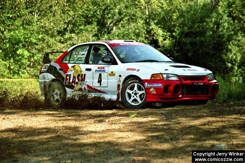 Garen Shrader / Michael Fennell Mitsubishi Lancer Evo IV at the spectator corner on SS10, Kabekona.