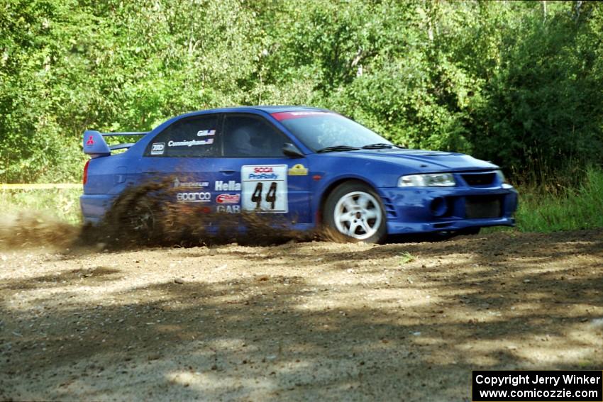 Peter Cunningham / Jim Gill Mitsubishi Lancer Evo VI at the spectator corner on SS10, Kabekona.
