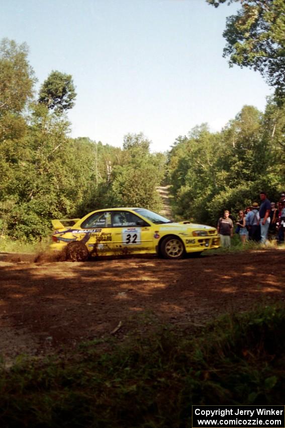 Paul Eklund / Scott Huhn Subaru Impreza at the spectator corner on SS10, Kabekona.