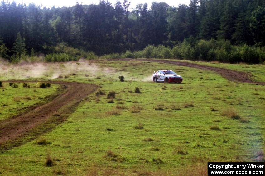 Garen Shrader / Michael Fennell Mitsubishi Lancer Evo IV goes wide at a corner on SS11, Ranch Super Special I.