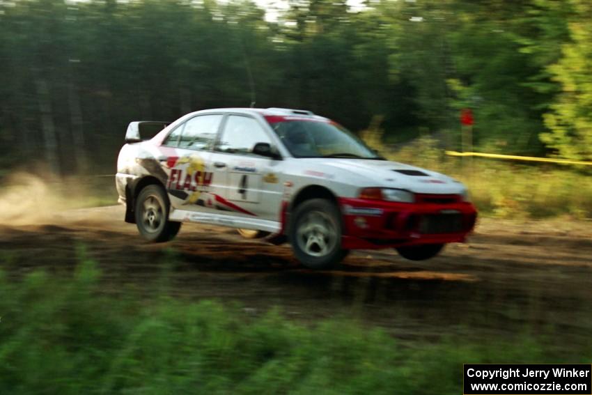 Garen Shrader / Michael Fennell Mitsubishi Lancer Evo IV catch air on SS14, East Steamboat.