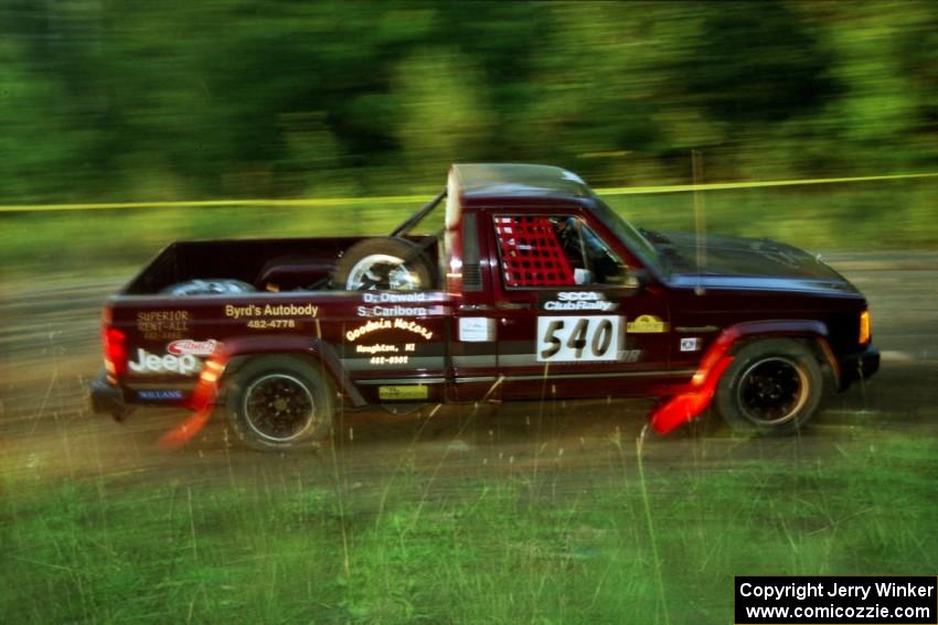 Scott Carlborn / Dale Dewald Jeep Comanche at speed on SS14, East Steamboat.