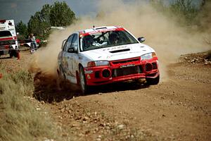 Garen Shrader / Michael Fennell Mitsubishi Lancer Evo IV through the spectator point on SS7.