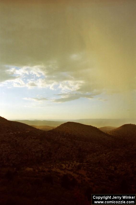 A thunderstorm rains over the mountainside.