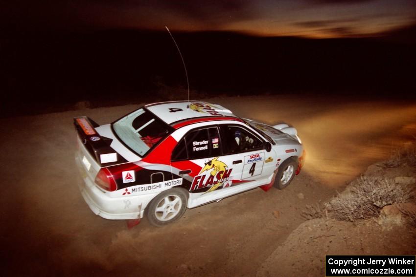 Garen Shrader / Michael Fennell Mitsubishi Lancer Evo IV just after sundown on SS2.