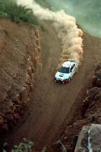 Garen Shrader / Michael Fennell Mitsubishi Lancer Evo IV heads through 'the cut' on the First View II stage.