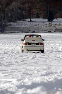 A VW Rabbit Cabriolet takes in the sunny day on the lake.