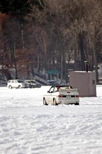 A VW Rabbit Cabriolet takes in the sunny day on the lake.