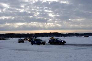 The field goes out for a pace lap prior to the start of a sprint race.