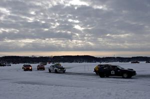 The field goes out for a pace lap prior to the start of a sprint race.