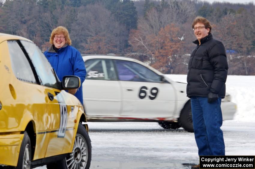 Julie Kochevar and John Kochevar in front of the Tony Burhans / Dan Burhans II SAAB 9-3