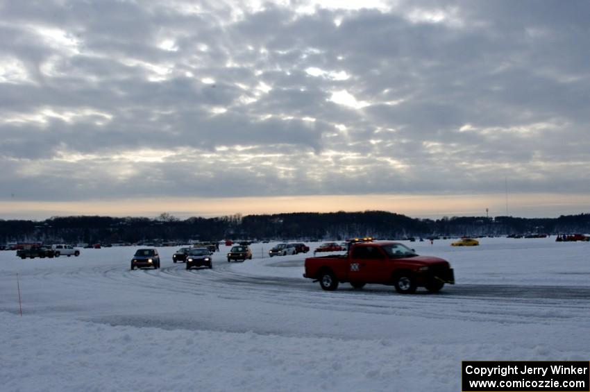 The field goes out for a pace lap prior to the start of a sprint race.