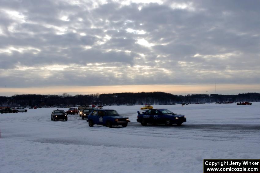 The field goes out for a pace lap prior to the start of a sprint race.