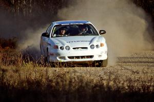 Perry King / Mark Williams Hyundai Tiburon at speed on the practice stage.
