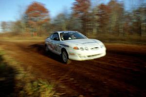 Perry King / Mark Williams Hyundai Tiburon at speed on the practice stage.