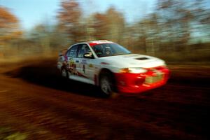 Garen Shrader / Michael Fennell Mitsubishi Lancer Evo IV at speed on the practice stage.