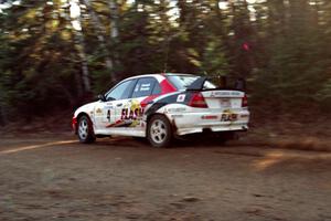 Garen Shrader / Michael Fennell Mitsubishi Lancer Evo IV at speed near the finish of SS1, Herman.