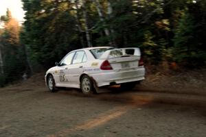 Seamus Burke / Frank Cunningham Mitsubishi Lancer Evo IV at speed near the finish of SS1, Herman.