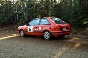 Gail Truess / Pattie Hughes Mazda 323GTX at speed near the finish of SS1, Herman.