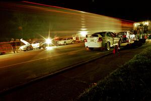 Libra Racing's Hyundai Tiburons on one side of the road with Vermont Sports Car's Mitsubishi Lancer Evos on the other.