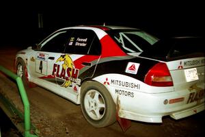 Garen Shrader / Michael Fennell Mitsubishi Lancer Evo IV at speed across the final bridge on SS10, Menge Creek.