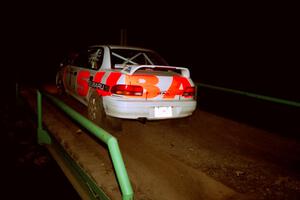 Henry Krolikowski / Cindy Krolikowski Subaru WRX STi at speed across the final bridge on SS10, Menge Creek.