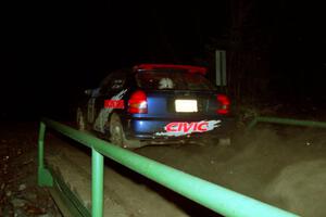 Bryan Hourt / Mike Dunn Honda Civic at speed across the final bridge on SS10, Menge Creek.