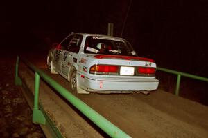 Todd Jarvey / Rich Faber Mitsubishi Galant VR-4 at speed across the final bridge on SS10, Menge Creek.