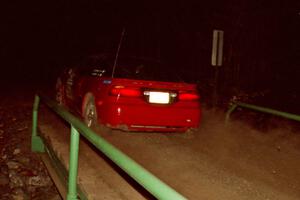 Shane Mitchell / Paul Donnelly Eagle Talon at speed across the final bridge on SS10, Menge Creek.