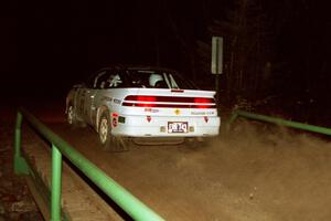 Chris Czyzio / Eric Carlson Mitsubishi Eclipse GSX at speed across the final bridge on SS10, Menge Creek.