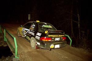 Pat Richard / Ben Bradley Subaru Impreza 2.5RS at speed across the final bridge on SS10, Menge Creek.