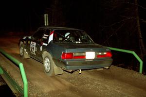 Mike Hurst / Rob Bohn Ford Mustang at speed across the final bridge on SS10, Menge Creek.