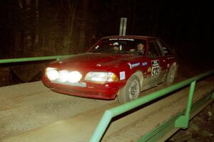 Jeremy Butts / Jon Vrzal Ford Mustang GT at speed across the final bridge on SS10, Menge Creek.