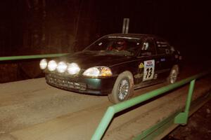 Nick Robinson / Carl Lindquist Honda Civic at speed across the final bridge on SS10, Menge Creek.