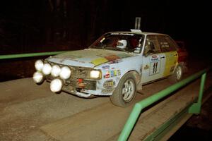 Ivan Orisek / Olga Orisek Audi 4000 Quattro at speed across the final bridge on SS10, Menge Creek.