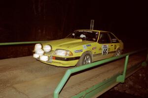 Don Rathgeber / Jimmy Brandt Ford Mustang LX at speed across the final bridge on SS10, Menge Creek.