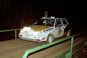 Brad Hawkins / Adrian Wintle VW GTI at speed across the final bridge on SS10, Menge Creek.