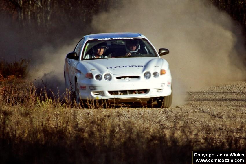 Perry King / Mark Williams Hyundai Tiburon at speed on the practice stage.