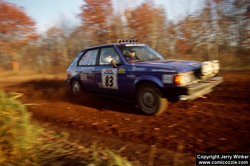 Mark Utecht / Brenda Corneliusen Dodge Omni GLH Turbo at speed on the practice stage.