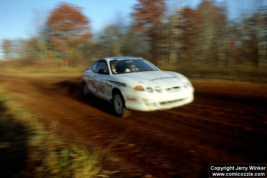 Perry King / Mark Williams Hyundai Tiburon at speed on the practice stage.