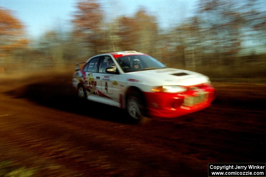 Garen Shrader / Michael Fennell Mitsubishi Lancer Evo IV at speed on the practice stage.