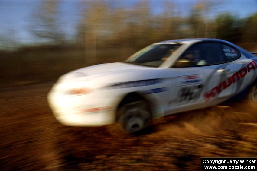 Perry King / Mark Williams Hyundai Tiburon at speed on the practice stage.