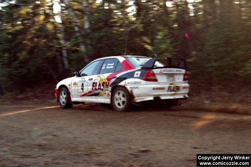 Garen Shrader / Michael Fennell Mitsubishi Lancer Evo IV at speed near the finish of SS1, Herman.